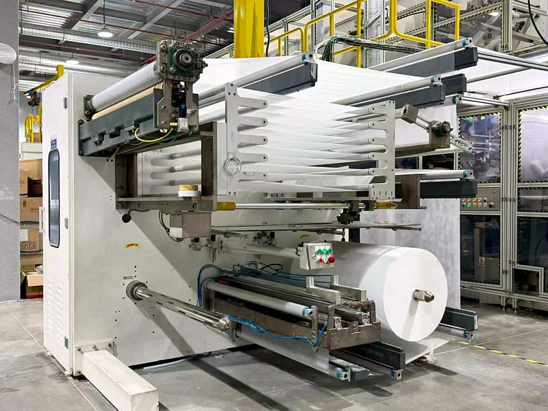 A nonwoven reel being loaded