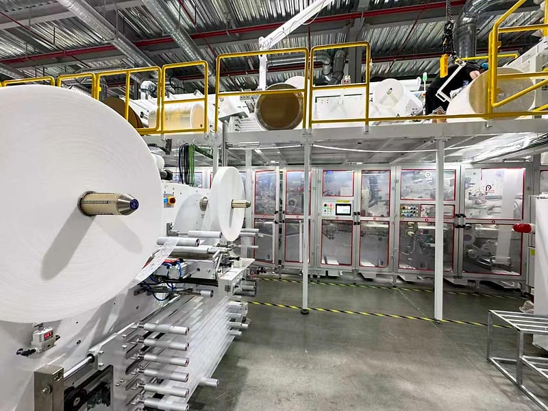 Nonwoven reels feeding a converting line